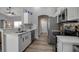 Modern kitchen featuring stainless steel appliances, white cabinets, and sleek countertops at 4673 Lummus St, North Port, FL 34286