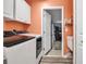 This laundry room features modern appliances, a utility sink, and an entry to a garage at 4673 Lummus St, North Port, FL 34286