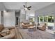 Open living space featuring neutral walls, hardwood flooring, and sliding glass doors to the patio at 4673 Lummus St, North Port, FL 34286