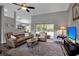 Bright living room featuring hardwood floors, neutral walls, open access to dining area, and glass door at 4673 Lummus St, North Port, FL 34286