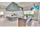 Modern kitchen featuring a large island, seating, and stainless steel appliances in the clubhouse at 4704 Stafford Ct, Palmetto, FL 34221