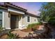 Inviting home entrance with brick walkway, garden beds, and classic architectural features at 4704 Stafford Ct, Palmetto, FL 34221