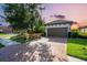 Beautiful home exterior featuring a large driveway and lovely landscaping at 4704 Stafford Ct, Palmetto, FL 34221