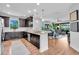 Spacious kitchen with granite countertops, stainless steel appliances, and an open layout to the living room at 4704 Stafford Ct, Palmetto, FL 34221