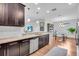 Modern kitchen with stainless steel appliances, granite countertops, and a breakfast bar at 4704 Stafford Ct, Palmetto, FL 34221