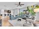 Open-concept living room with two sofas and a view of the kitchen at 4704 Stafford Ct, Palmetto, FL 34221