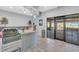 Lounge with granite countertop, mini fridges, and access to the pool and outdoor area at 4704 Stafford Ct, Palmetto, FL 34221