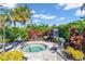 Relaxing community spa with tropical foliage and comfortable seating at 4704 Stafford Ct, Palmetto, FL 34221