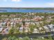 Waterfront property aerial view showing neighborhood, boat docks, and access to the open bay at 4964 Commonwealth Dr, Sarasota, FL 34242