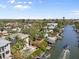Beautiful aerial view of a waterfront community with lush landscaping, docks, and canal access at 4964 Commonwealth Dr, Sarasota, FL 34242
