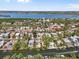 Waterfront property aerial view showing neighborhood, boat docks, and access to the open bay at 4964 Commonwealth Dr, Sarasota, FL 34242