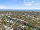 Aerial view of a waterfront property with direct access to the ocean, close to the beach at 4964 Commonwealth Dr, Sarasota, FL 34242
