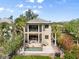 Beautiful aerial view of a two-story home with a private pool and multiple balconies at 4964 Commonwealth Dr, Sarasota, FL 34242