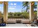 Inviting waterfront balcony with comfortable seating and scenic canal views at 4964 Commonwealth Dr, Sarasota, FL 34242