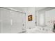 Elegant bathroom features marble countertops and a walk-in glass shower enclosure at 4964 Commonwealth Dr, Sarasota, FL 34242