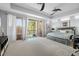 Expansive bedroom with private balcony access and lots of natural light at 4964 Commonwealth Dr, Sarasota, FL 34242