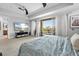 Spacious bedroom with neutral carpeting and private balcony access overlooking outdoor views at 4964 Commonwealth Dr, Sarasota, FL 34242