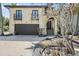 Elegant home with a two-car garage, charming balconies, and attractive landscaping at 4964 Commonwealth Dr, Sarasota, FL 34242