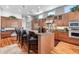 Gourmet kitchen with stainless steel appliances and granite countertops at 4964 Commonwealth Dr, Sarasota, FL 34242