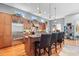Spacious kitchen featuring a center island with bar seating, stainless steel appliances, and natural light at 4964 Commonwealth Dr, Sarasota, FL 34242