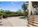 Private pool area with brick patio and lush landscaping at 4964 Commonwealth Dr, Sarasota, FL 34242