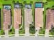 Aerial shot displaying multiple homes with pools, barrel tile roofs, brick paved driveways, and verdant landscaping at 5019 Serata Dr, Lakewood Ranch, FL 34211