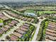 An aerial view showcases lush landscaping, a golf course, and well-maintained roadways in this community at 5019 Serata Dr, Lakewood Ranch, FL 34211