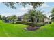 View of the screened-in lanai with a pool and meticulously maintained backyard landscaping at 5019 Serata Dr, Lakewood Ranch, FL 34211
