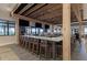 Upscale community bar area with seating and views of the pool outside at 5019 Serata Dr, Lakewood Ranch, FL 34211