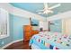 Charming bedroom with wood floors, four poster bed, and colorful quilt at 5019 Serata Dr, Lakewood Ranch, FL 34211