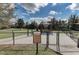 Well-maintained dog park with green space, shelter, and clear signage providing rules and regulations at 5019 Serata Dr, Lakewood Ranch, FL 34211