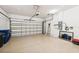 Spacious two-car garage with painted walls and a concrete floor at 5019 Serata Dr, Lakewood Ranch, FL 34211