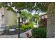 Tranquil garden featuring lush landscaping and a charming white arbor at 5019 Serata Dr, Lakewood Ranch, FL 34211