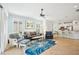 Bright living room with stylish furniture, neutral walls, and tile flooring at 5019 Serata Dr, Lakewood Ranch, FL 34211