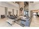 Modern lobby with high ceilings, decorative lighting, comfortable seating, and stylish decor at 5019 Serata Dr, Lakewood Ranch, FL 34211