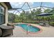 Beautiful screened-in pool area with brick patio and outdoor seating at 5019 Serata Dr, Lakewood Ranch, FL 34211
