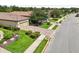 Street view of a home with manicured landscaping, a brick driveway, and mature trees at 5019 Serata Dr, Lakewood Ranch, FL 34211