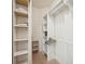 Walk-in closet with custom shelving and ample storage space at 5019 Serata Dr, Lakewood Ranch, FL 34211