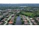 Beautiful aerial view of a landscaped community with waterfront homes and lush green spaces at 5032 Timber Chase Way, Sarasota, FL 34238