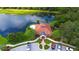 Aerial view of community clubhouse, pool, parking and lake at 5032 Timber Chase Way, Sarasota, FL 34238