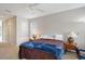 Neutral bedroom with carpeted floors, a ceiling fan, and natural light from windows at 5032 Timber Chase Way, Sarasota, FL 34238
