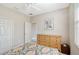 Bedroom featuring a ceiling fan, neutral walls, a dresser, and a closet at 5032 Timber Chase Way, Sarasota, FL 34238