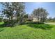 A charming house surrounded by vibrant greenery, featuring a manicured lawn and a well-maintained driveway at 5032 Timber Chase Way, Sarasota, FL 34238