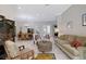 A spacious living room offering a blend of relaxation and entertainment; seamlessly connected to the dining area at 5032 Timber Chase Way, Sarasota, FL 34238