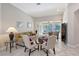 A comfortable living room provides ample seating and a seamless transition to an outdoor screened-in patio at 5032 Timber Chase Way, Sarasota, FL 34238