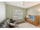 Cozy living room with a comfortable couch and a view through the plantation shutters at 5032 Timber Chase Way, Sarasota, FL 34238
