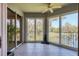 Enclosed balcony with tile floor, ceiling fan, and scenic water views at 5238 Manorwood Dr # 3C, Sarasota, FL 34235