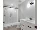 Contemporary bathroom featuring glass shower, modern vanity, and stylish fixtures at 5238 Manorwood Dr # 3C, Sarasota, FL 34235