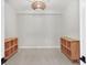Bedroom featuring modern light fixture and matching wooden cubbies at 5238 Manorwood Dr # 3C, Sarasota, FL 34235