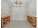 Bedroom featuring modern light fixture and matching wooden cubbies at 5238 Manorwood Dr # 3C, Sarasota, FL 34235